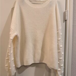 Cozy Cream Knit Sweater with Pom-Pom Sleeve Detail